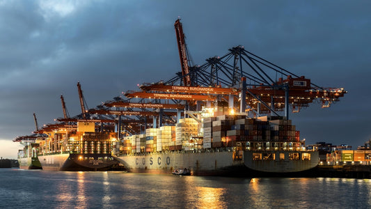 a large cargo ship docked at a dock