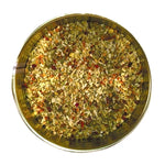 Onion, spices (black pepper, basil, oregano, celery seed, bay, savory, thyme, cayenne pepper, coriander, cumin, mustard, rosemary) garlic, lemon juice powder, carrot, citric acid, lemon peel, natural lemon flavor, oil of lemon, turmeric extract and chili pepper.